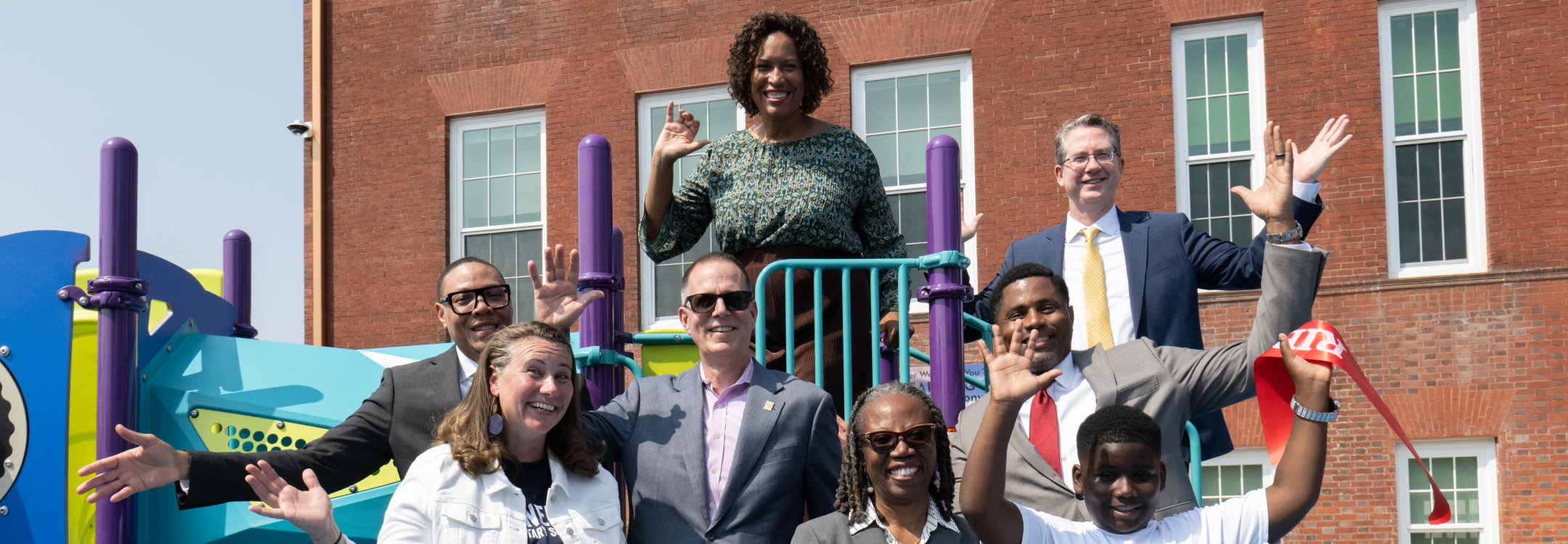 Mayor Muriel Bowser, City Administrator, and education officials pose in front of a new school